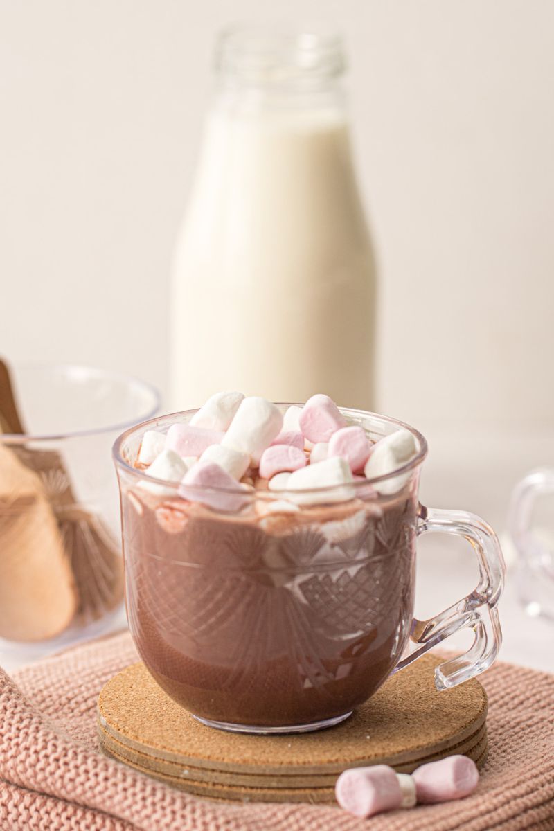 A cup of protein hot chocolate with marshmallows on the top.