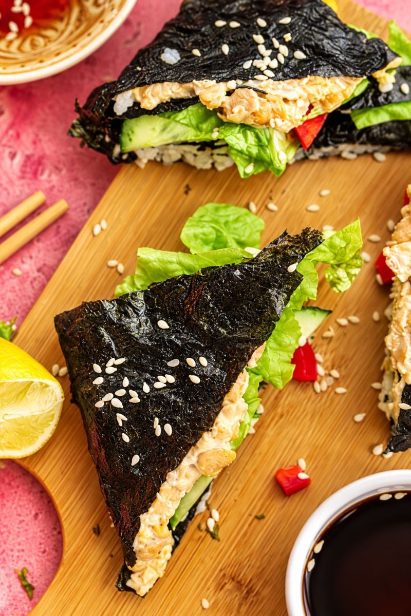 Sushi wraps with soya sauce on the side. 