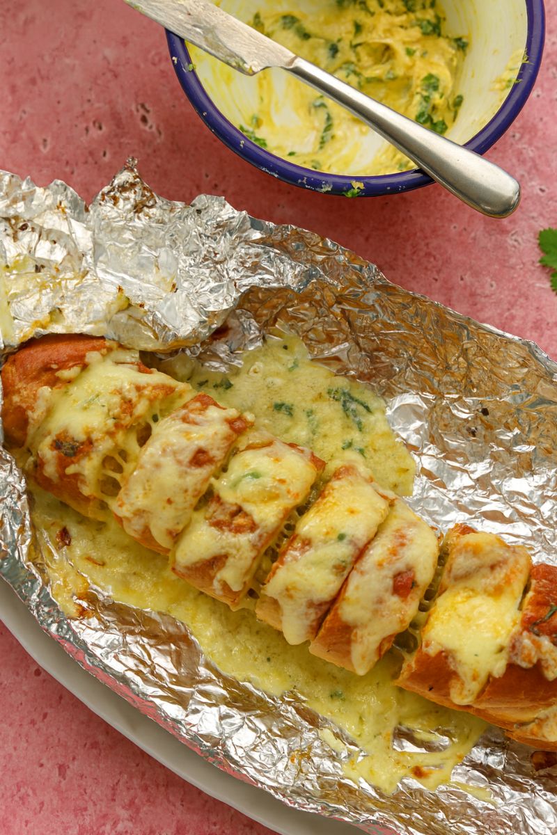 Garlic bread and melted cheese in foil. 