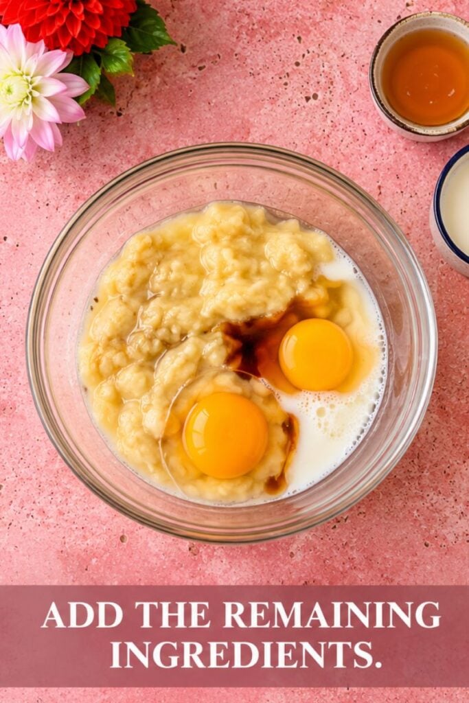 Banana milk eggs and honey added to a blender for blackberry muffins.