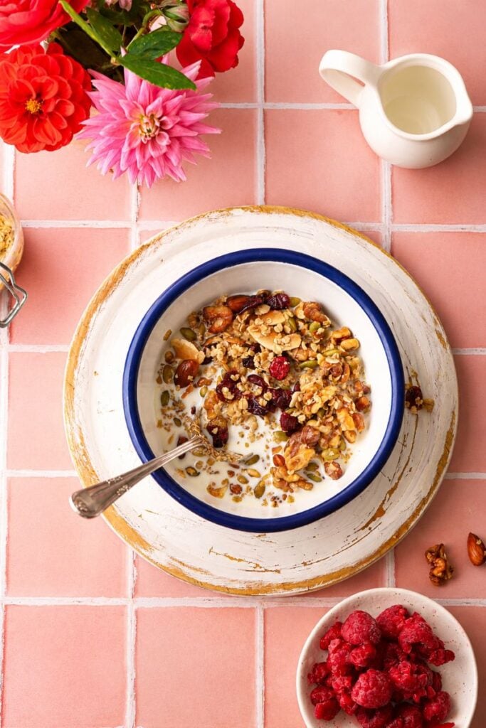 Crunchy sugar free granola with walnuts, almonds, pumpkin seeds and dried cranberries served with milk.