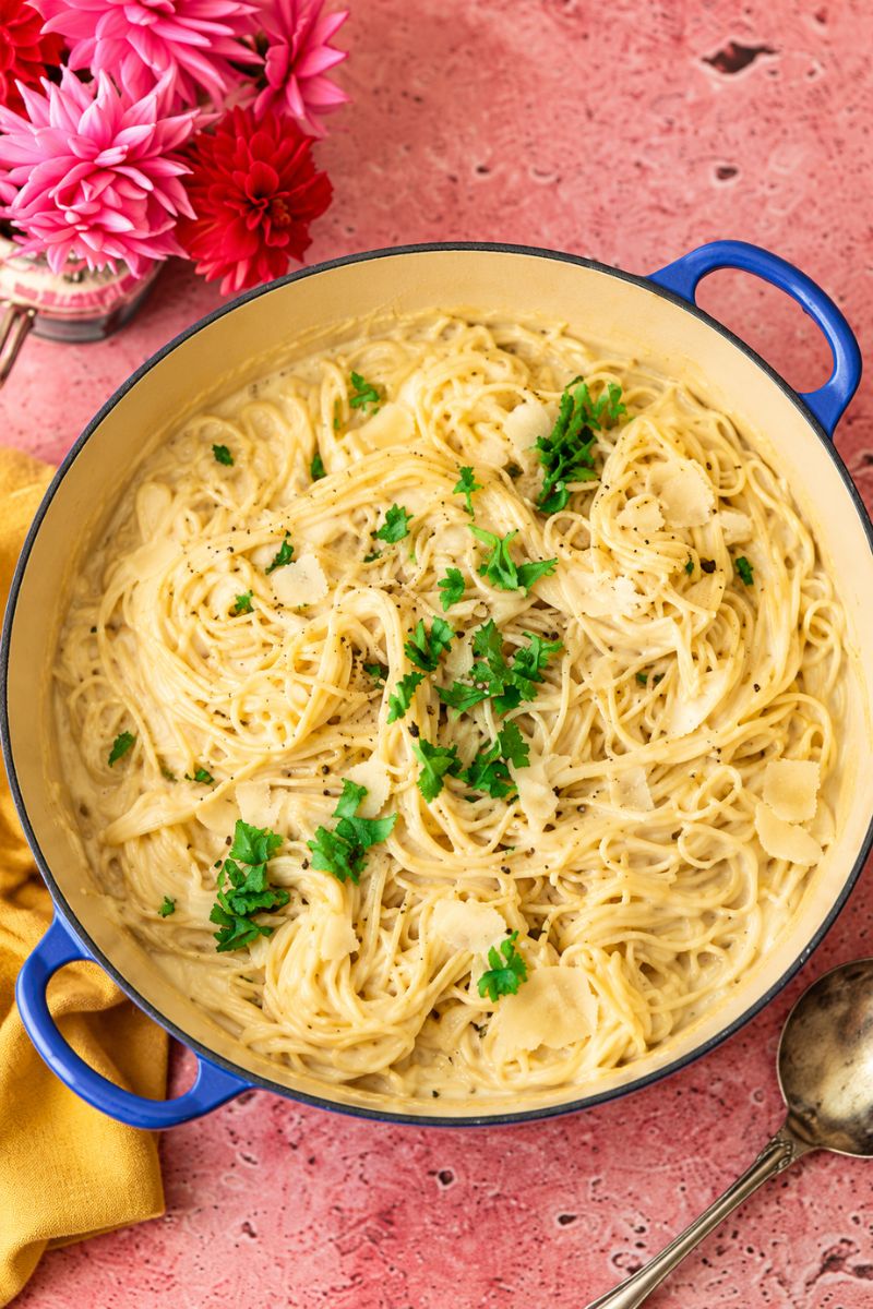 Creamy spaghetti Alfredo with Parmesan cheese and fresh parsley.
