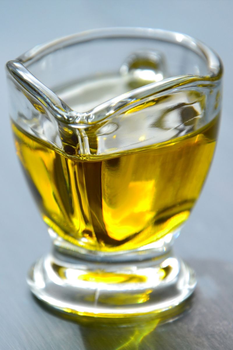 Canola oil in a glass jug.