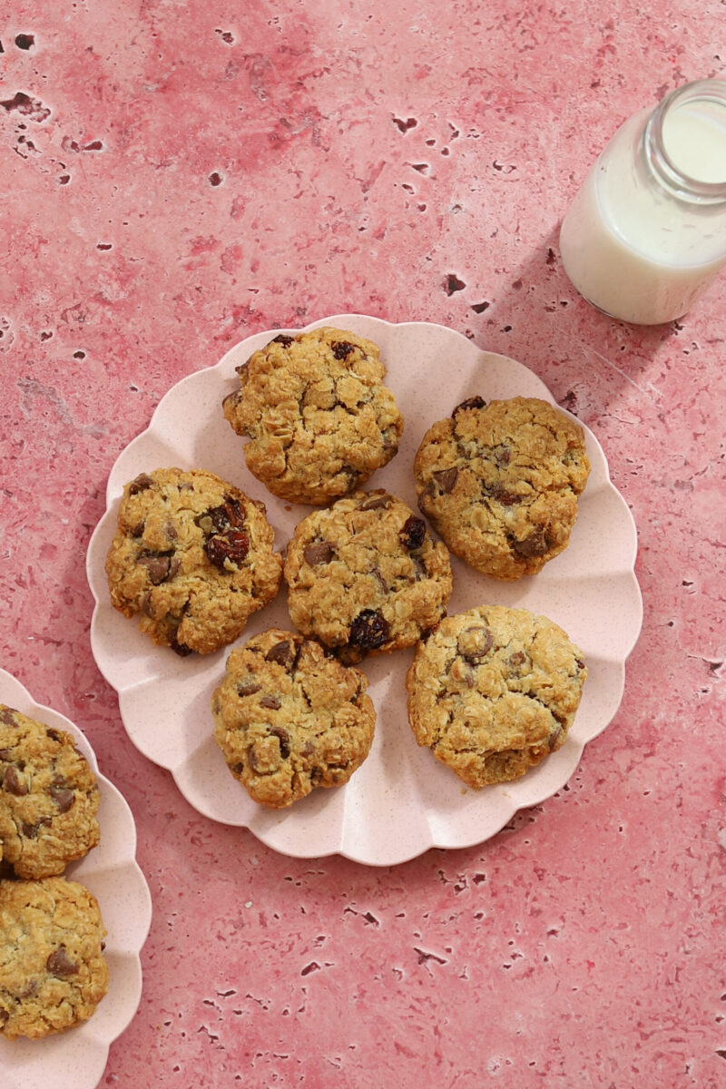 A plate of cookies and a jug of milk. 