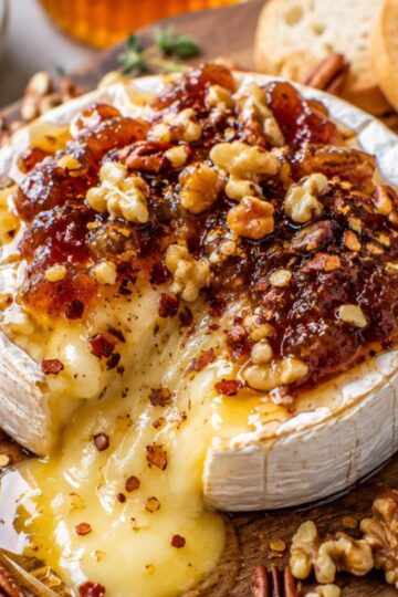 Baked brie with honey, jam, chili and nuts.