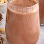 Chocolate cashew milk in a glass.