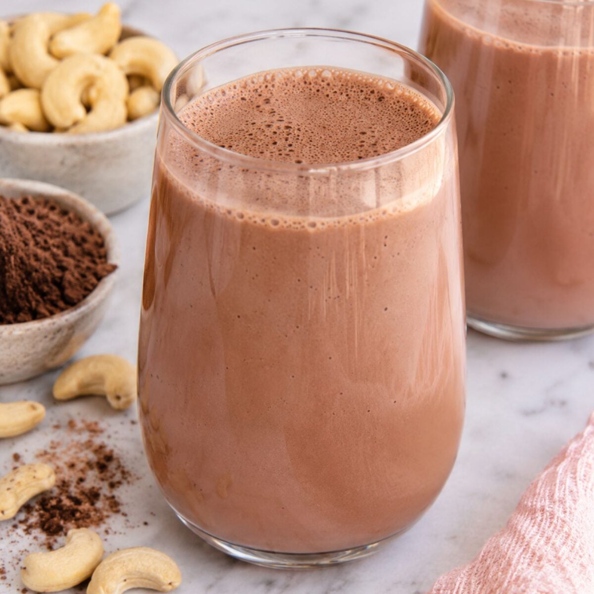 Chocolate cashew milk in a glass.