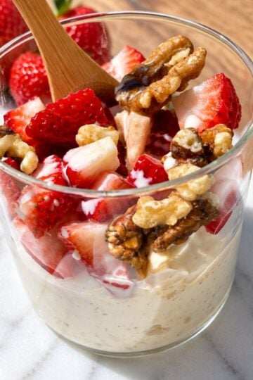 Semolina dessert with honey, cream, berries and nuts.