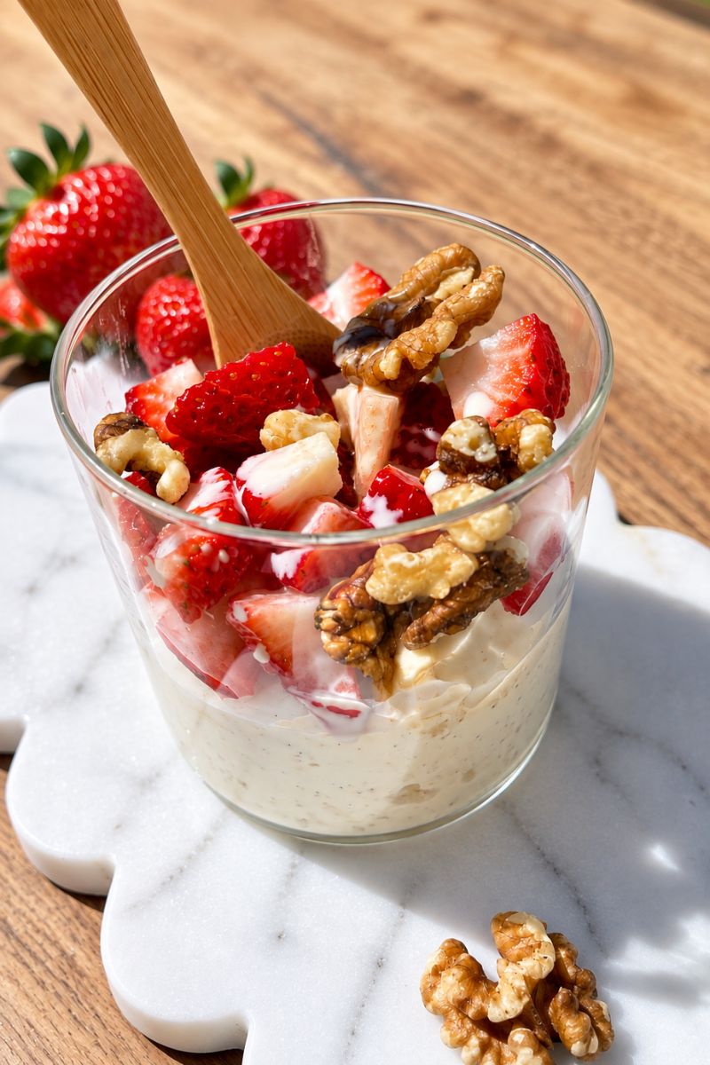 Semolina dessert with honey, cream, berries and nuts.
