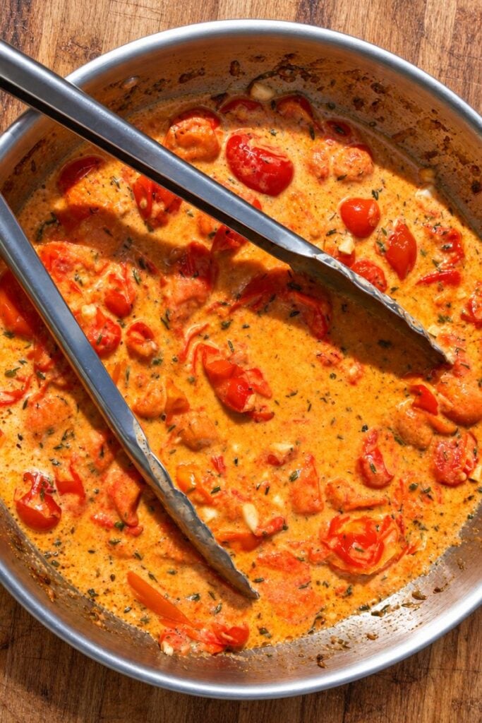 Cream added to the cooked cherry tomato sauce.