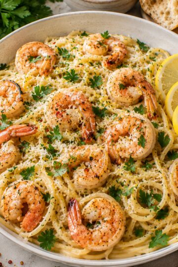 Garlic butter noodles with shrimp in a bowl.