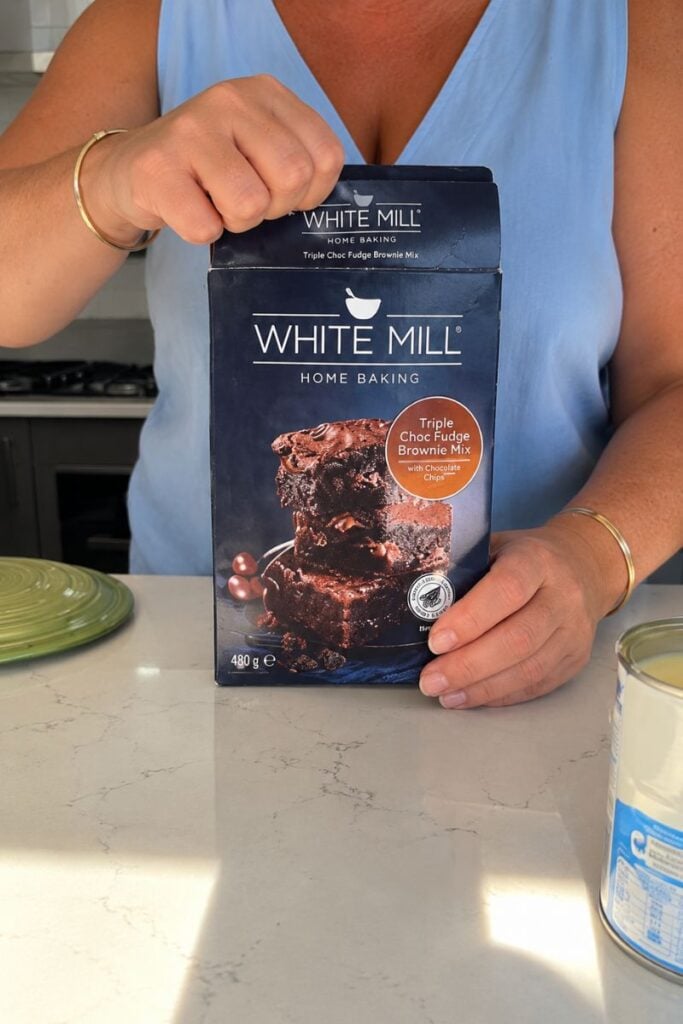 Opening the brownie mix.
