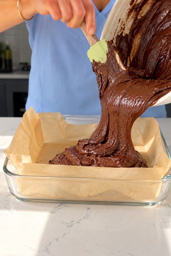 Pouring the batter into the prepared pan. 