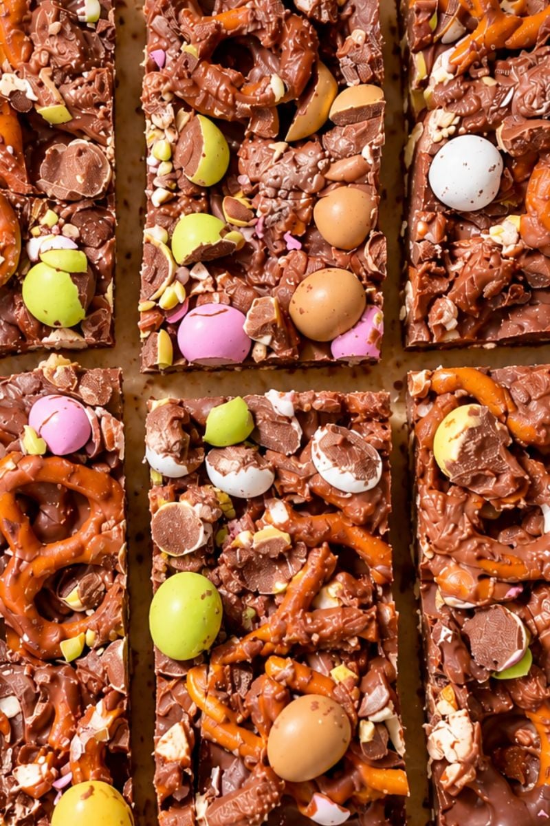 Close-up of Easter chocolate bark with pretzels and mini candy eggs.