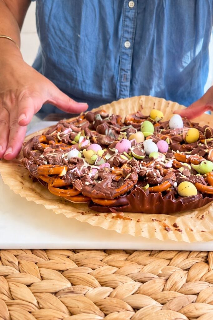 Easter chocolate bark with melted chocolate pretzels and mini candy eggs.