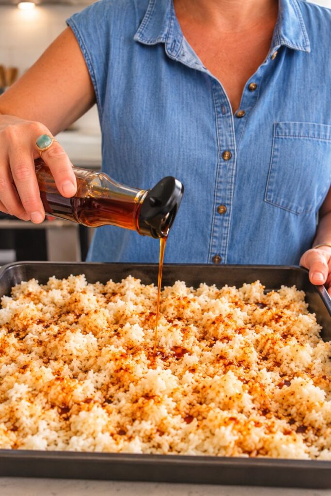 Cooked rice with soy sauce and sesame oil ready for baking