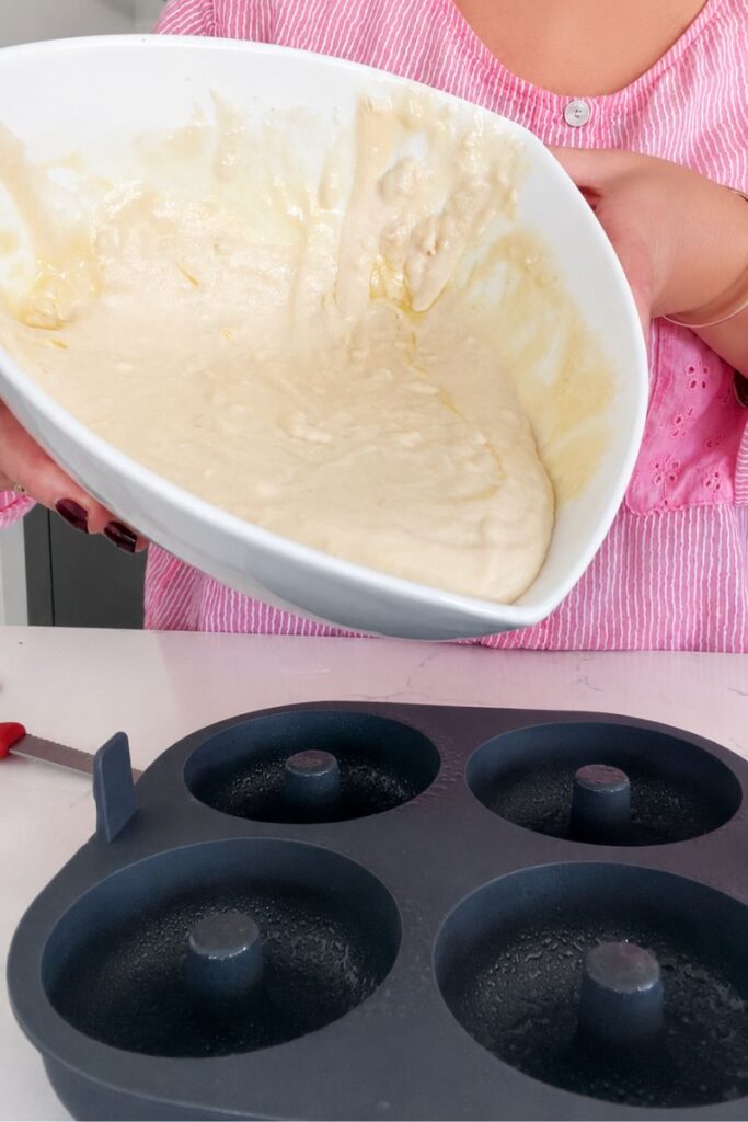 Pouring in the batter.