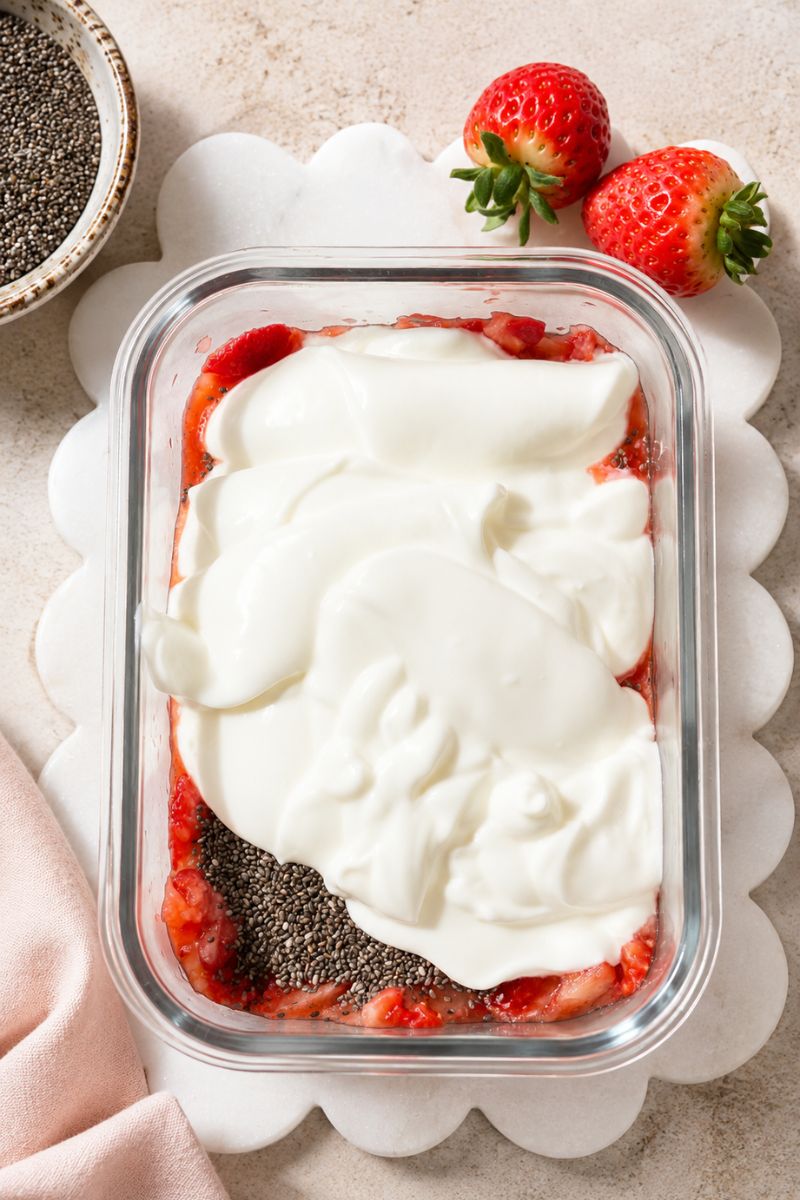 Mashed strawberries with chia seeds and yogurt.