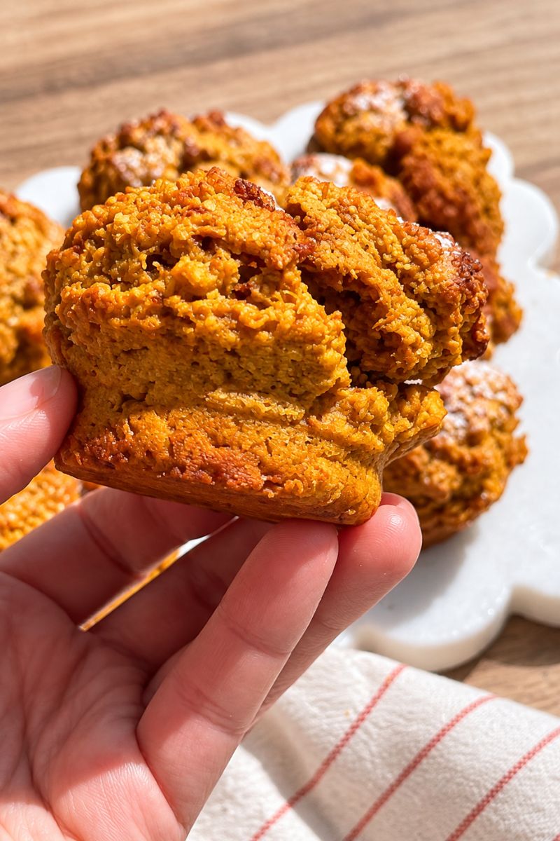 Homemade pumpkin oat muffins on a serving plate.