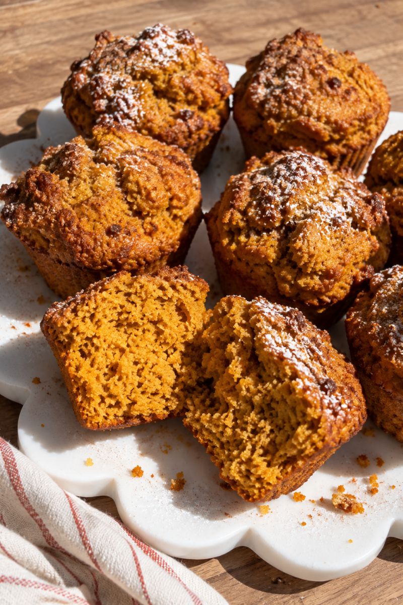 Soft pumpkin muffin showing the moist oat flour crumb.