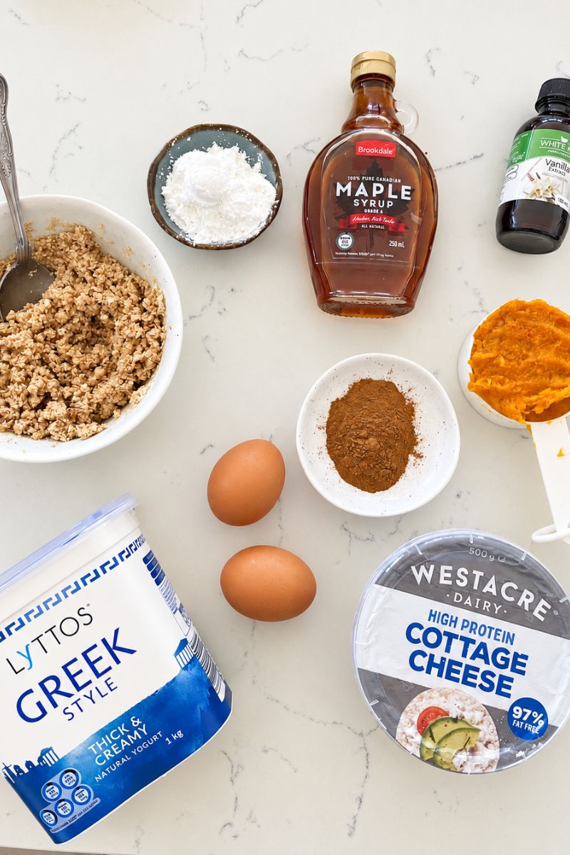Pumpkin cottage cheese cheesecake ingredients with pumpkin puree, cottage cheese, Greek yogurt and eggs.