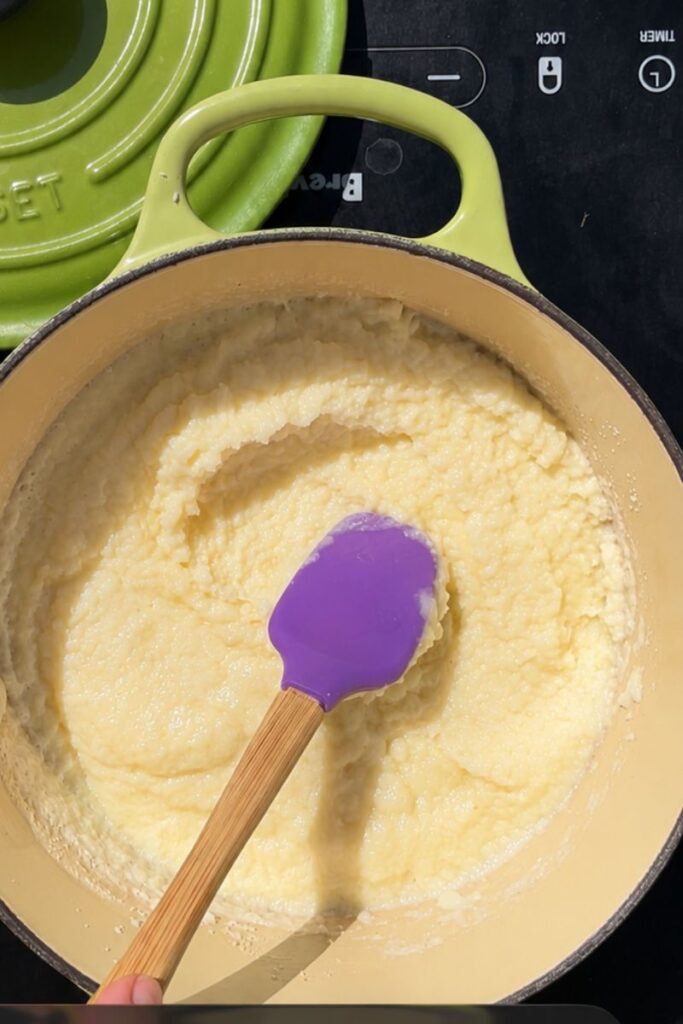 Thick and creamy semolina pudding after cooking on the stovetop